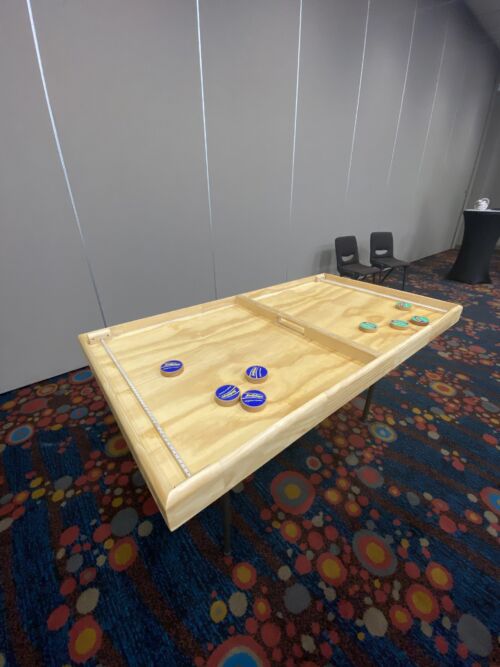 Branded flick board Event games team building NZ