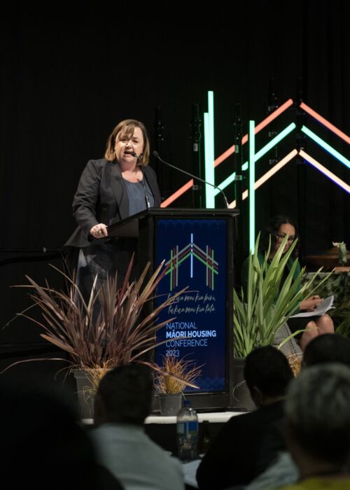 NZ housing minister on stage at the national maori housing conference 2023